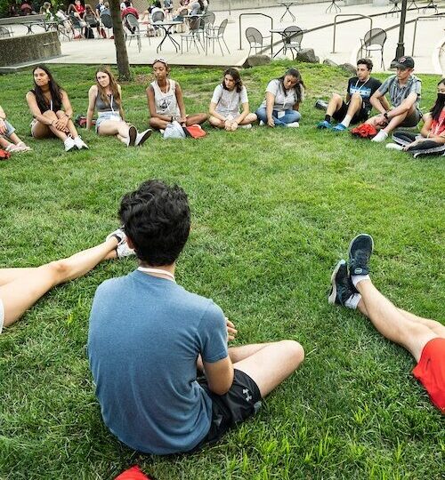 Student sitting in the grass
